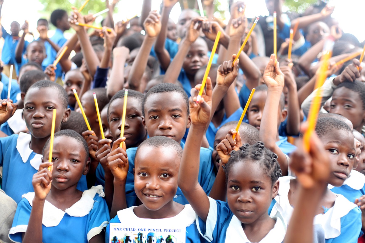 Children in the central region of Cameroon hold up new pencils they received in the One Child, One Pencil Project, a community outreach and evangelism campaign sponsored by United Methodist Women. Photo by Marius Bonfeu. 