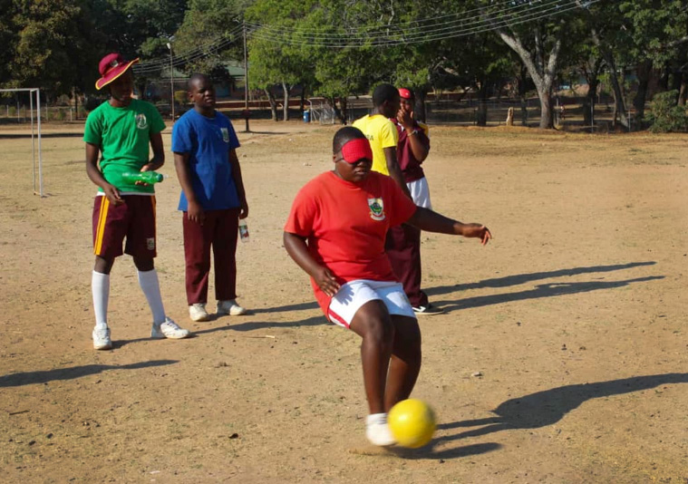 Monalisa Makoma, a student at Murewa United Methodist High School in Zimbabwe, kicks the ball during practice for the International Blind Soccer Association’s upcoming women's training camp and games in Japan. Photo by Chenayi Kumuterera, UMNS.