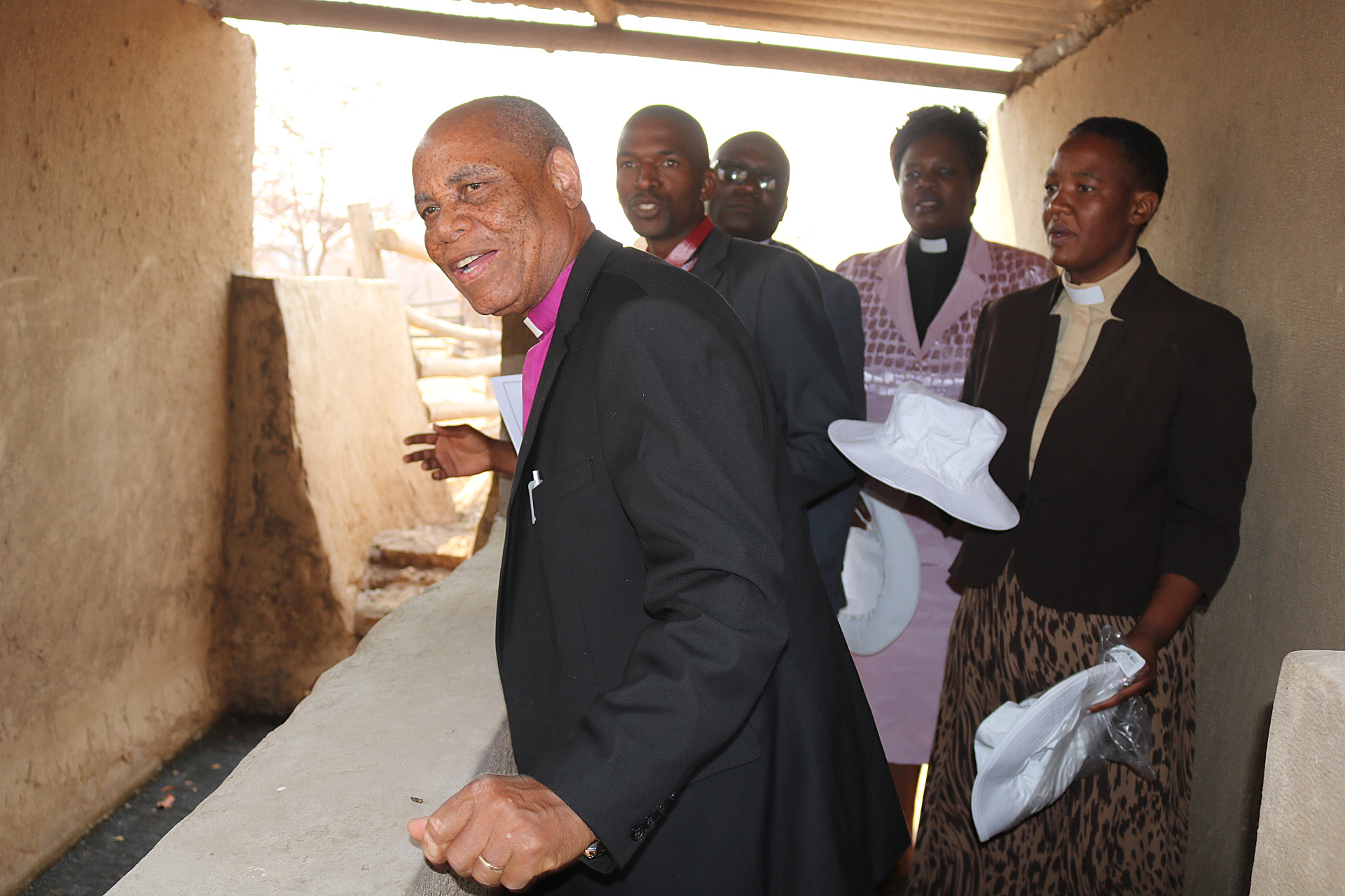 Zimbabwe Resident Bishop Eben K. Nhiwatiwa inspects the inside of the cattle dip tank. The dip tank was built by the church with funding from the Chabadza Community Development Program, a partnership between The United Methodist Church in Norway and Zimbabwe. Photo by Eveline Chikwanah, UMNS. 
