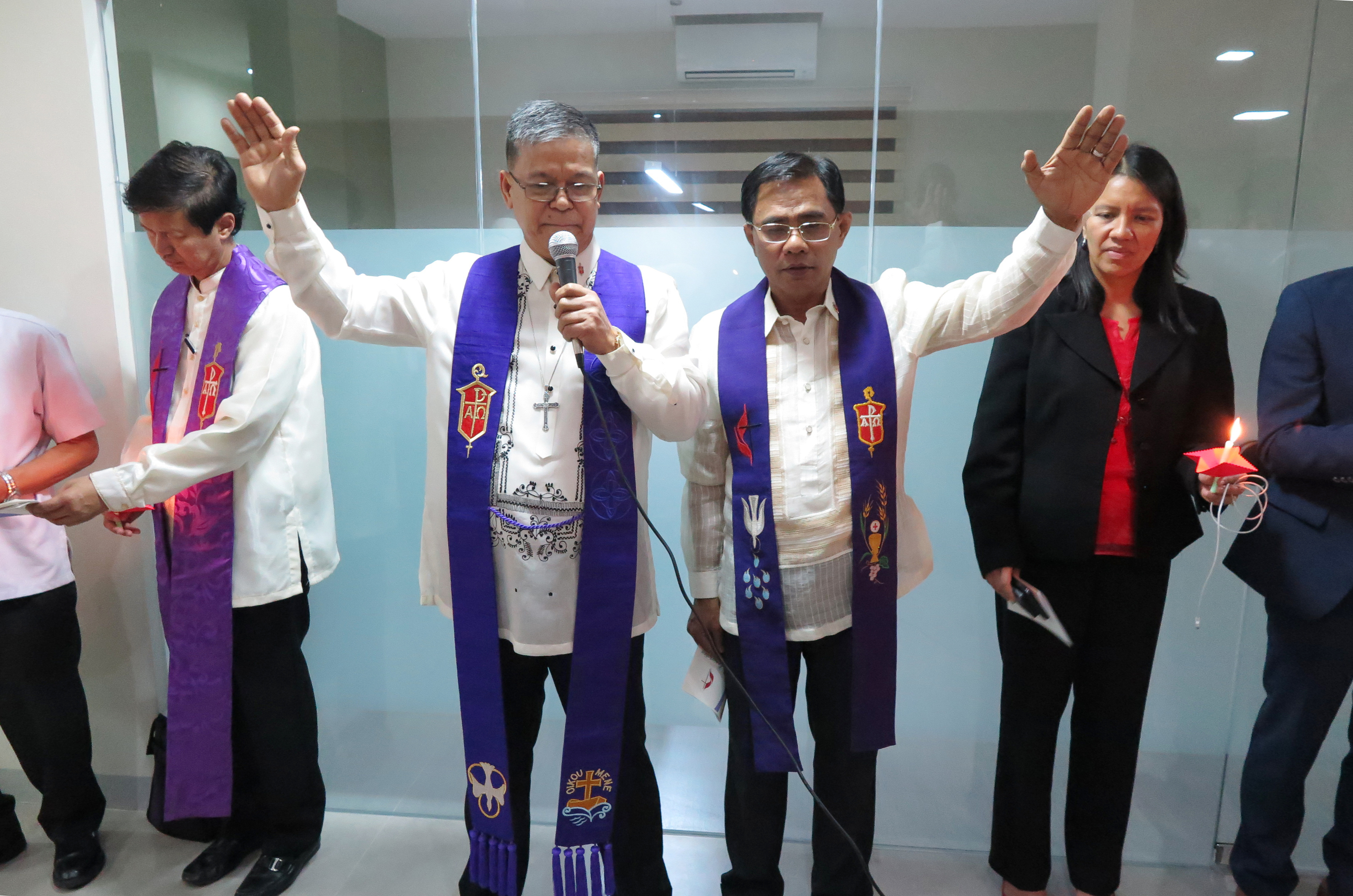Bishops Ciriaco Q. Francisco and Rodolfo A. Juan raise their hands in blessing during the dedication ceremony. Bishop Pedro M.  Torio Jr. and the Rev. Amy Valdez-Barker are in the background. Photo by Tim Tanton, UMNS.