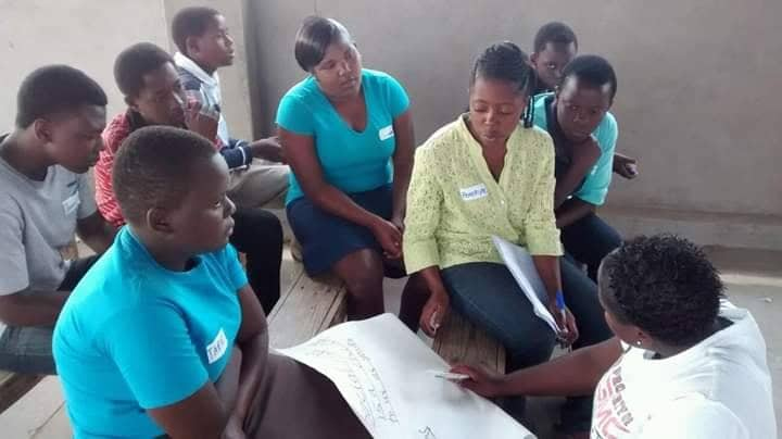 Youth from Gormonzi United Methodist Church youth discuss internet security as part of a guidance and counseling session around issues of human trafficking. Photo by Priscilla Muzerengwa, UMNS. 