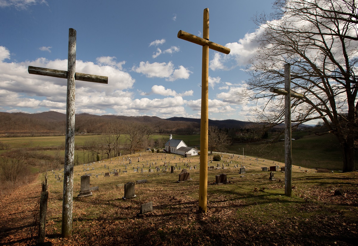 Three crosses stand above the cemetery at Israel United Methodist Church near Montrose, W.Va., in 2015. Leaders of rural churches have expressed concerns about the impact that decisions made at the special General Conferences could have on rural and small congregations. File photo by Mike DuBose, UMNS.