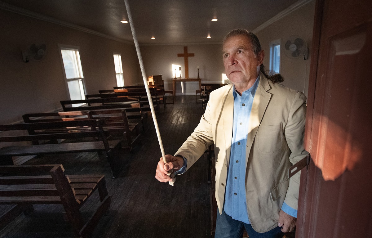 Ramiro Ramírez rings the bell at Jackson Chapel United Methodist Church in San Juan, Texas. Ramírez’ family donated land for the church, which was established in 1874. President Trump’s proposed border wall is slated to run through the church property, including its historic cemetery. Photo by Mike DuBose, UMNS. 