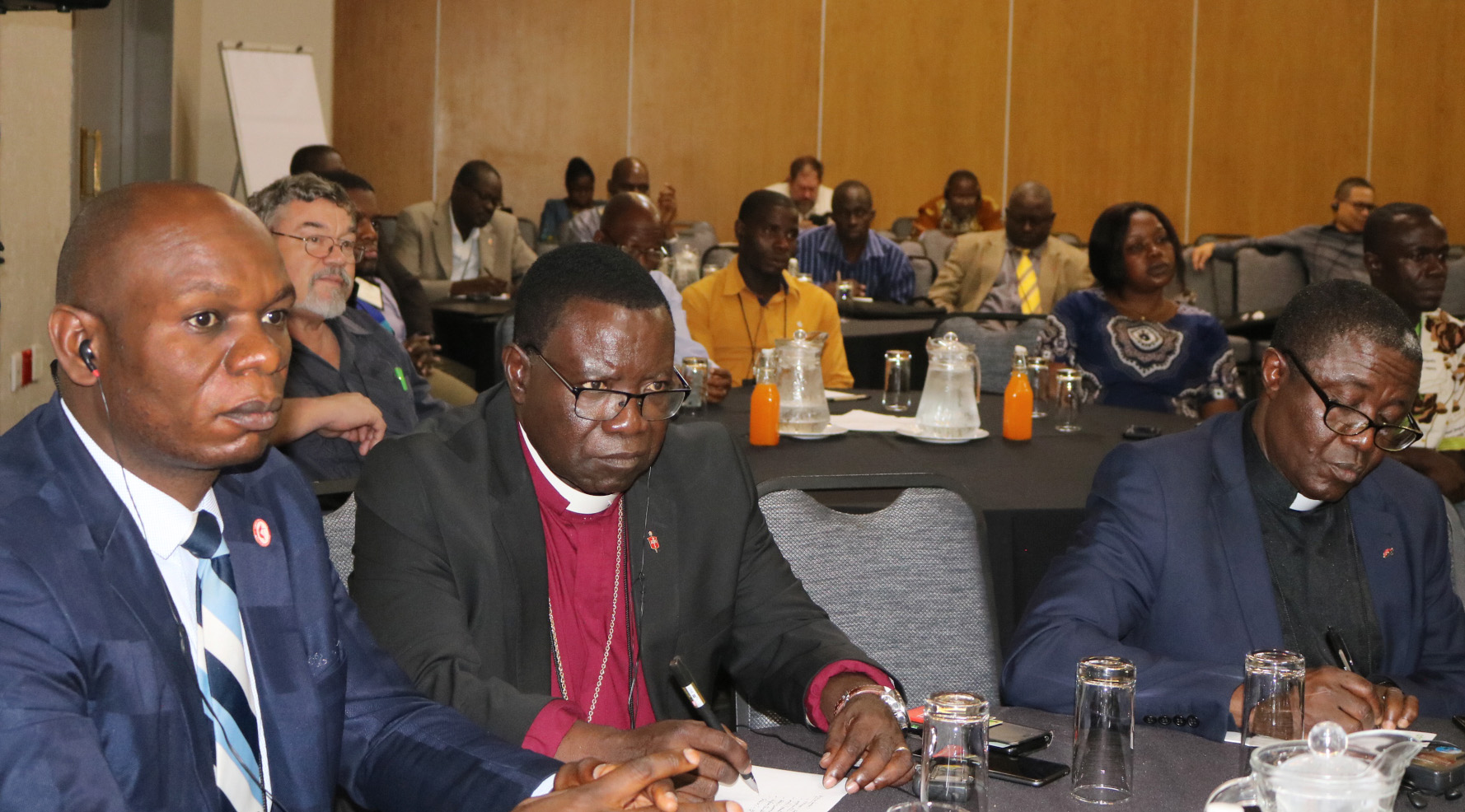 Bishop Kasap Owan from the South Congo Episcopal area (center) and delegates listen during the United Methodist Board of Global Ministries/United Methodist Committee on Relief agricultural summit in Johannesburg. Photo by Eveline Chikwanah.