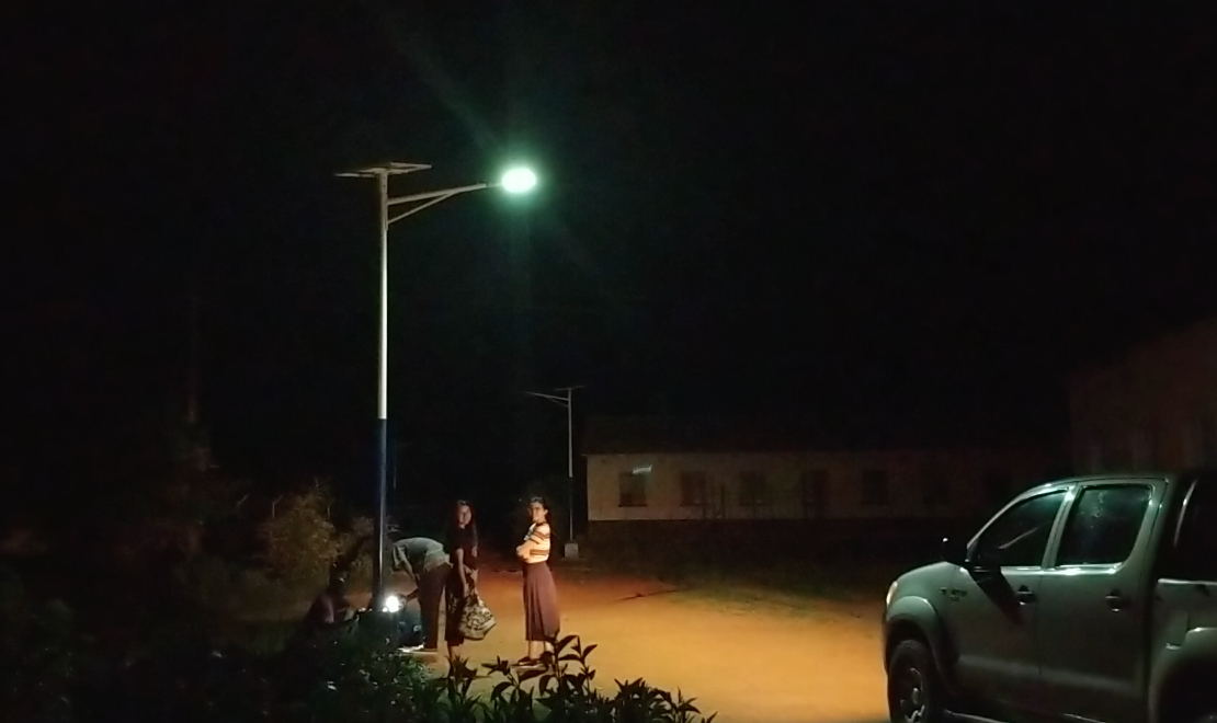 Students with Engineers Without Borders USA observe solar lights during a night tour at Nyadire Mission in Zimbabwe. Photo courtesy of Chenayi Kumuterera.