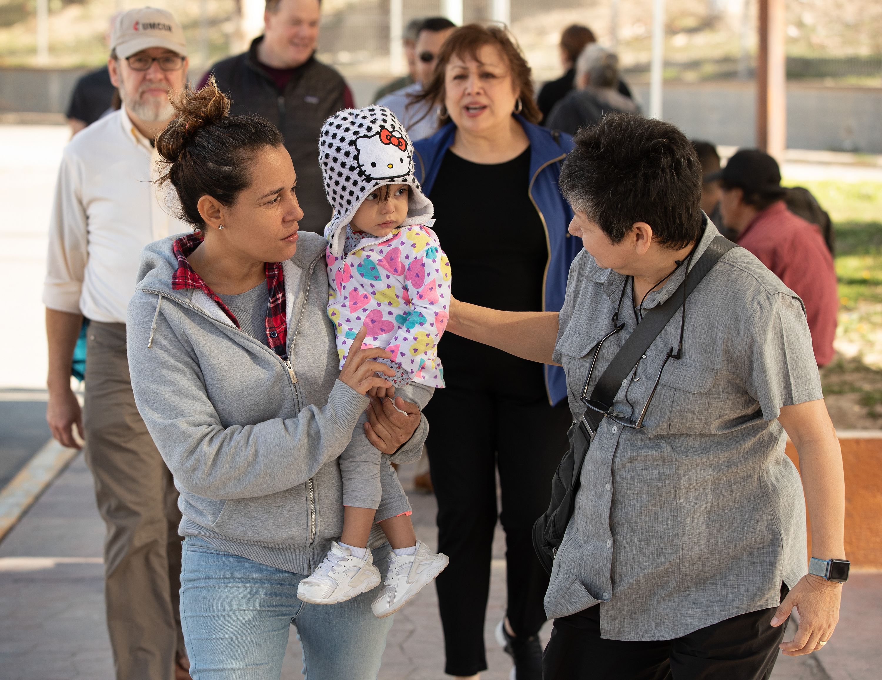 United Methodist deaconess Cindy Johnson (right) walks to buy medicine with Isabél who traveled with her daughter from Nicaragua to Matamoros, Mexico, hoping to request asylum in the U.S. Kassandra, 16 months, was suffering from fever and weight loss while she and her mother waited for their turn to approach the bridge leading to Brownsville, Texas. Johnson, who makes regular visits to the makeshift camp, brought members of the United Methodist Immigration Task Force for a firsthand look at the immigration situation. Photo by Mike DuBose, UMNS.