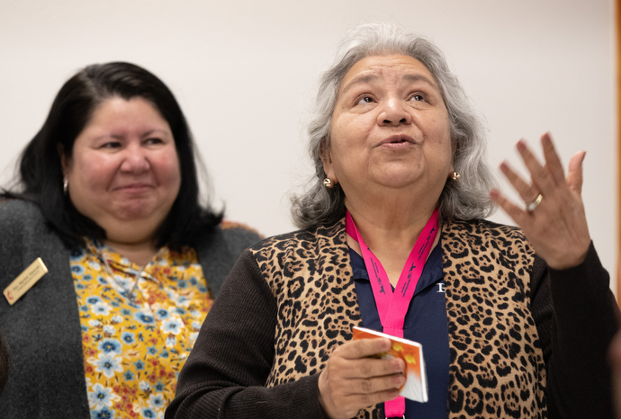 Kiko Villarreal (right) tells members of the United Methodist Immigration Task Force, meeting in McAllen, Texas, about the ordeal she endured when her husband, who had lived in the U.S. for almost 50 years, was arrested after an old DUI conviction came to light during a brief trip to Mexico. Despite having paid the fine and fulfilled the terms of the criminal penalty, he was detained for three months. With her is her pastor, the Rev. Maribel Vazquez. Photo by Mike DuBose, UMNS.