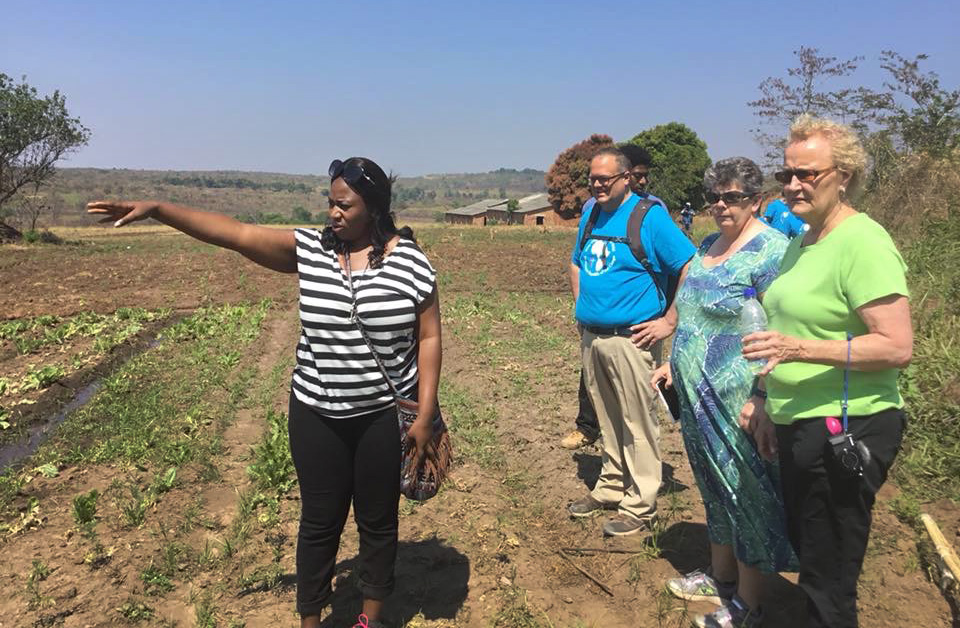 Lorraine Charinda, a missionary from Zimbabwe, shows visitors from the West Ohio Conference around Kamisamba Farm in North Katanga, Congo. West Ohio is the partner conference of the North Katanga and Tanganyika conferences. Photo courtesy of Lorraine Charinda.