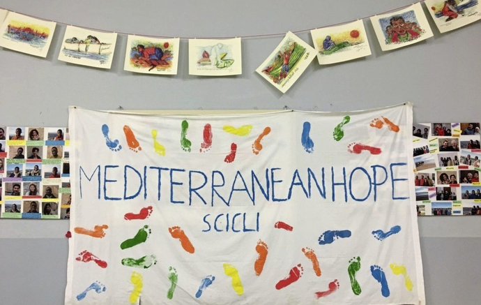 A homemade banner hangs on the wall at the House of Cultures in Scicli, Italy. The project was started by local Methodists and Mediterranean Hope. Photo courtesy of Mediterranean Hope.