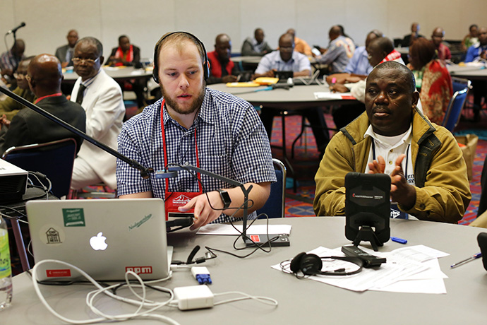 Matt Crum (left), Solutions Architect, Global Communications Technology,  was part of the tablet training team from United Methodist Communications during the 2016 United Methodist General Conference in Portland, Ore. Photo by Kathleen Barry, UMNS.