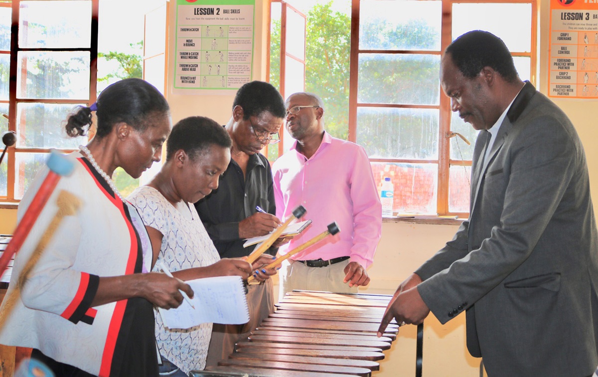 Walter Mujuru (right), Zimbabwe West Conference music director, teaches marimba basics to participants at the episcopal area’s annual arts workshop in Mutoko, Zimbabwe. Photo by Eveline Chikwanah, UMNS.