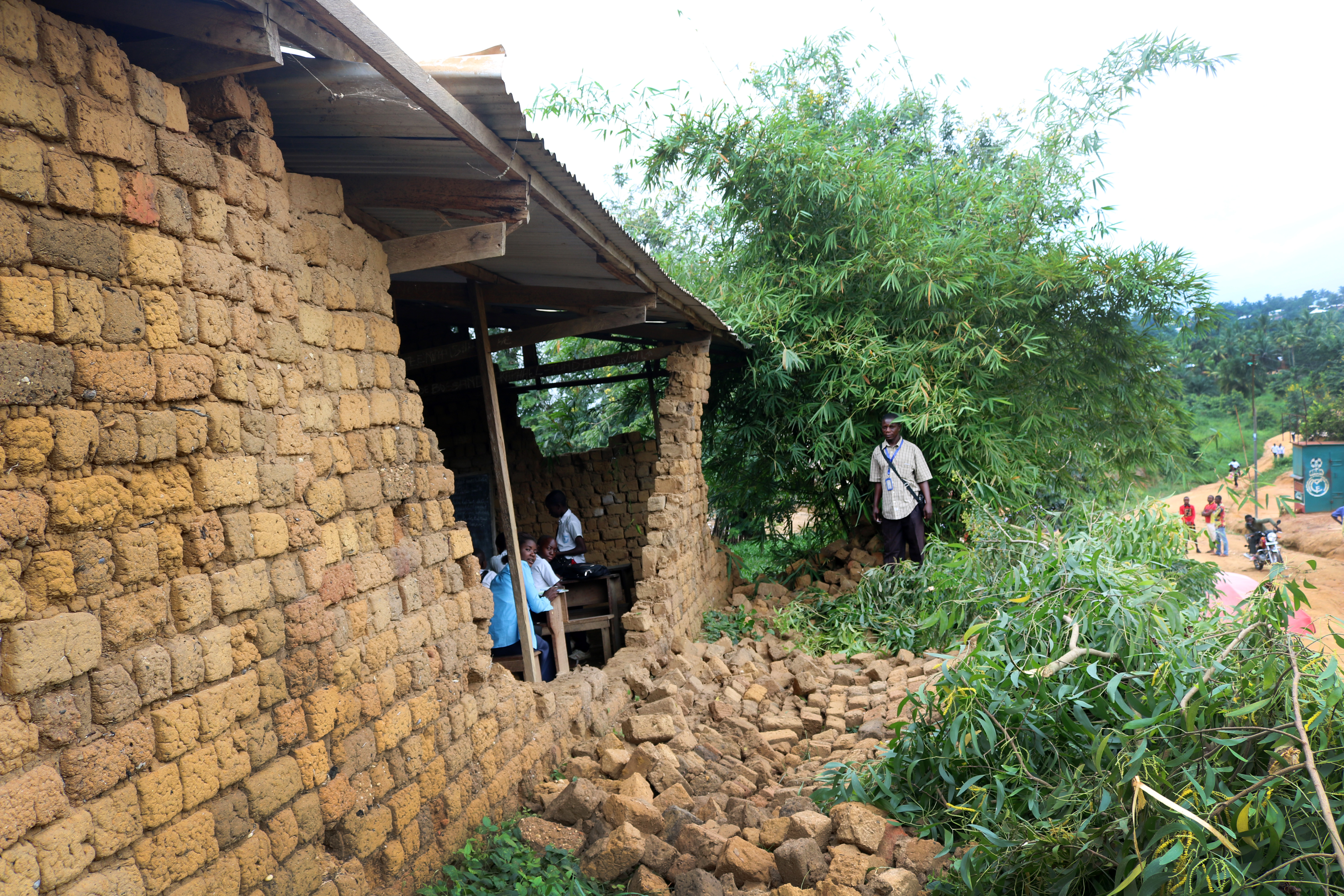 Students work in a storm-damaged classroom at Lufungula Institute, a United Methodist school in Kindu, Congo. Photo by Chadrack Tambwe Londe, UMNS.