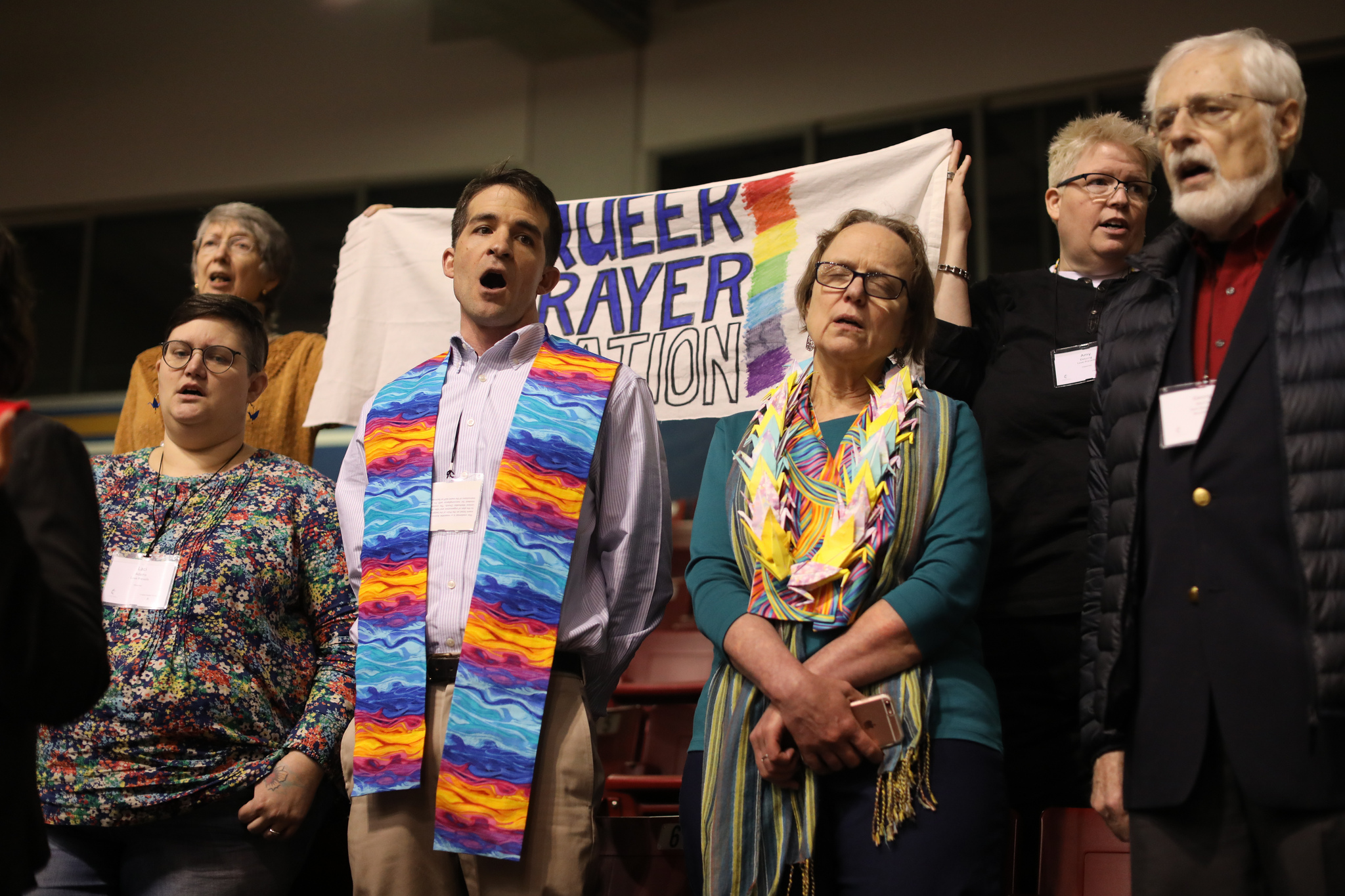The Rev. Will Green (center) leads the singing of "Jesus Remember Me When You Come Into Your Kingdom" at the "Queer Prayer Station" during the Feb. 23 morning of prayer at the 2019 Special Session of the United Methodist General Conference in St. Louis. Photo by Kathleen Barry, UMNS.