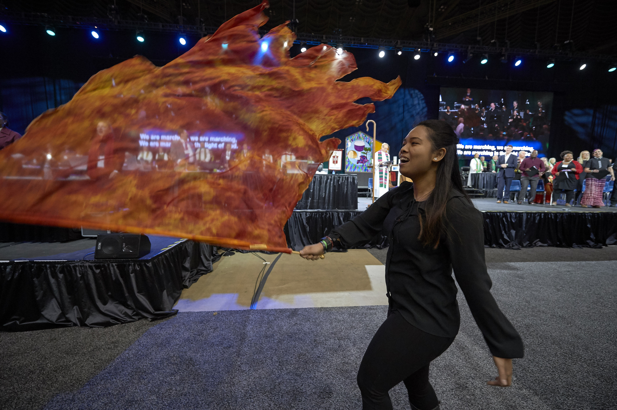 A liturgical dancer waves a flag during worship on February 24, 2019, at the Special Session of the General Conference of The United Methodist Church, held in St. Louis, Missouri. Photo by Paul Jeffrey, UMNS.