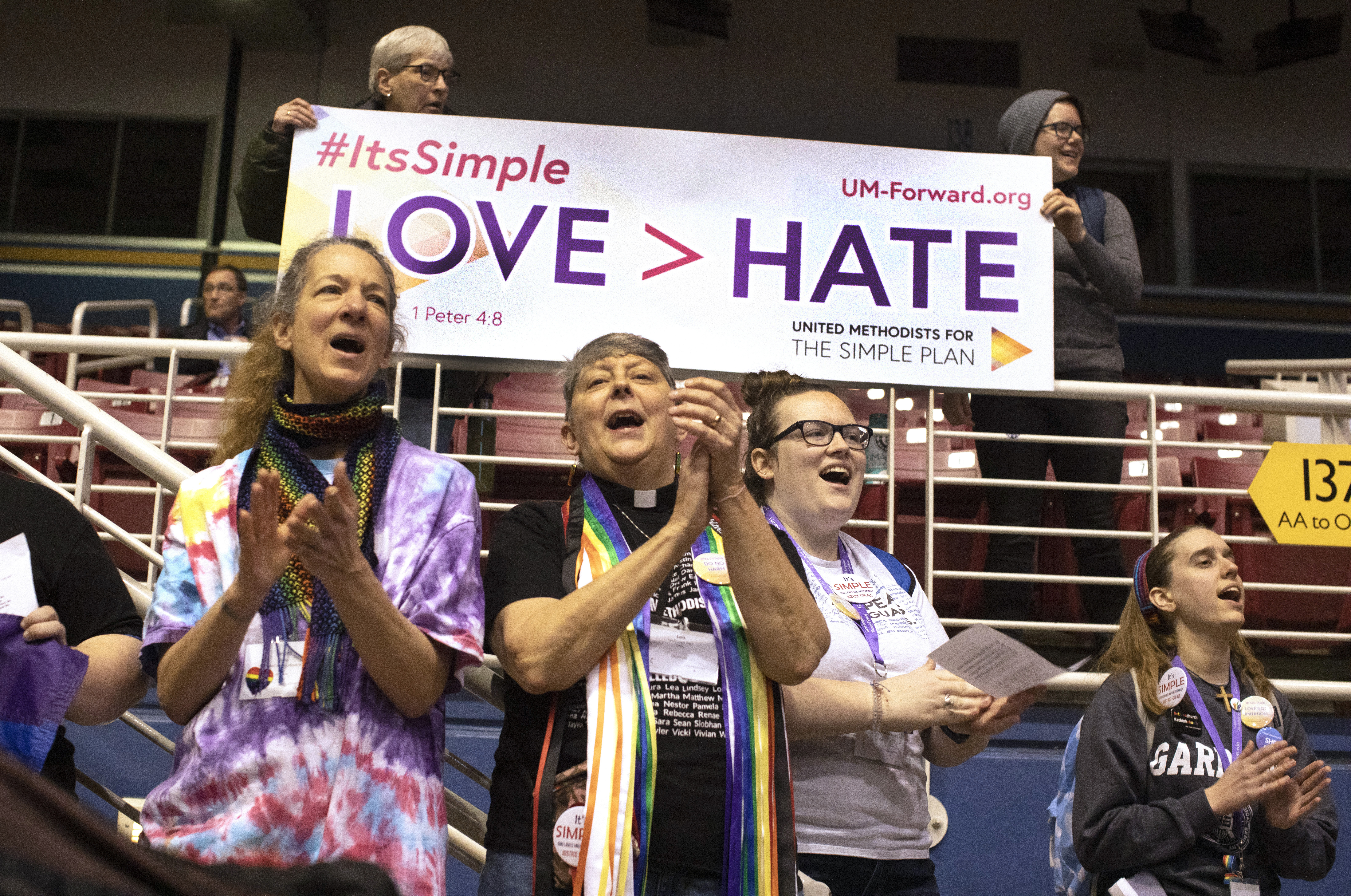 Supporters for the Simple Plan hold banners and sing before the afternoon session at the 2019 Special Session of the United Methodist General Conference. The demonstration was held inside the Dome of America's Center in St. Louis on Feb. 24. Photo by Kathleen Barry, UMNS.