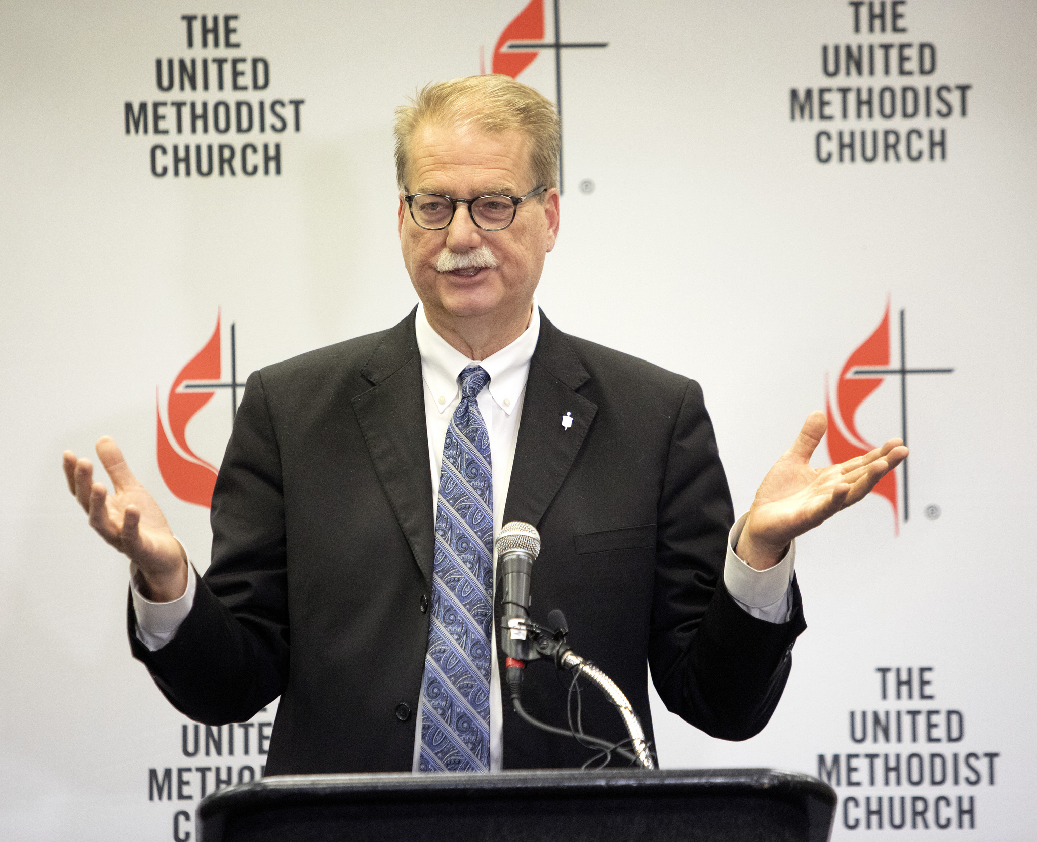 Bishop Kenneth H. Carter, president of the Council of Bishops, speaks to the press following the conclusion of the 2019 United Methodist General Conference in St. Louis. Photo by Kathleen Barry, UMNS.