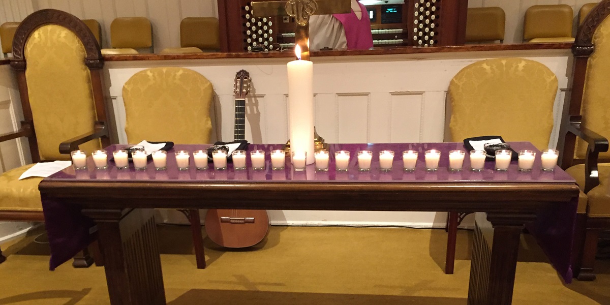 The candles on the altar at First United Methodist Church in Opelika, Ala. represent the 23 people killed in a March 3 tornado that hit Lee County, Ala. The remembrance service was held on Ash Wednesday. Photo courtesy First United Methodist Church, Opelika.