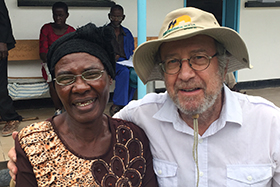 Don Ziegler, head of The Nyadire Connection’s eyeglasses program, poses with 72-year-old Mabel Chibuounda in Chindenga, Zimbabwe. Chibuounda could only read two lines of the eye chart before receiving new glasses. Photo courtesy of Don Ziegler.