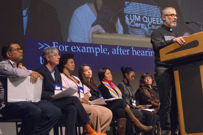 The Rev. Alex da Silva Souto, a delegate to the 2019 United Methodist General Conference, addresses the special session of the New York Annual Conference where delegates shared their reflections on what happened in St. Louis. From left are: Jorge Lockward, the Revs. Kristina Hansen, Sheila Beckford and Vicki Flippin, Karen Prudente, Tiffany French Goffe and the Rev. Martha Vink. Photo by Stephanie Parsons.