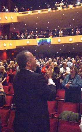 General Conference delegate Fred Brewington (foreground) applauds with others in attendance at the New York Conference special session. Photo by Stephanie Parsons.