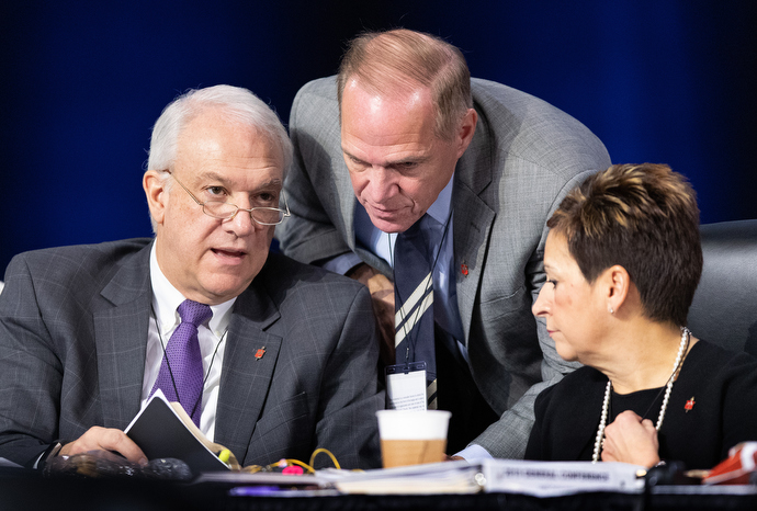 Bishops confer during the 2019 United Methodist General Conference in St. Louis. From left are Bishops Thomas Bickerton, John Schol, and Cynthia Fierro Harvey. Bickerton, a member of the Commission of General Conference and a member of the task force that will be looking into potential voting irregularities, said integrity is his primary concern. “It is disappointing to think there has been any kind of impropriety whatsoever.” Photo by Mike DuBose, UMNS.