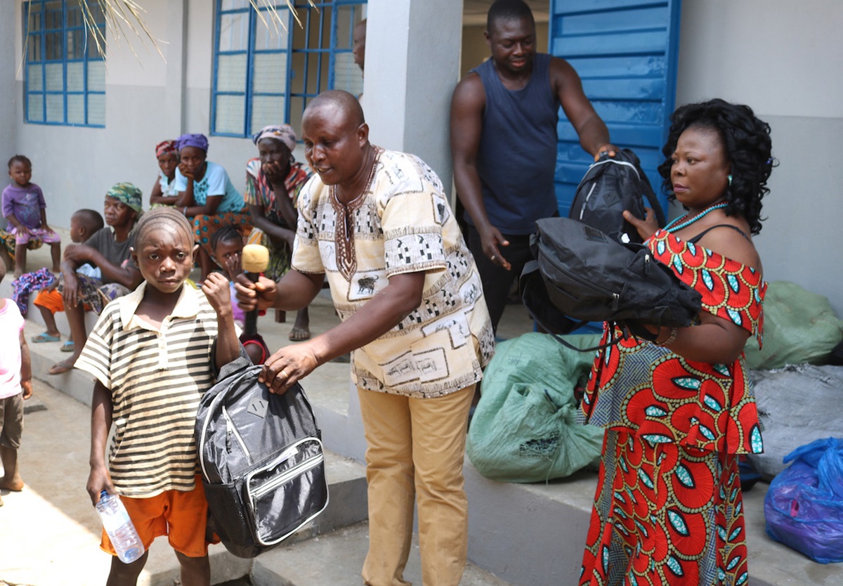 A new student at The United Methodist Church Primary School in Sayllu, Sierra Leone, receives a backpack, uniform, shoes, books and other learning materials in preparation for the start of the 2019 school year. Photo by Phileas Jusu, UMNS. 