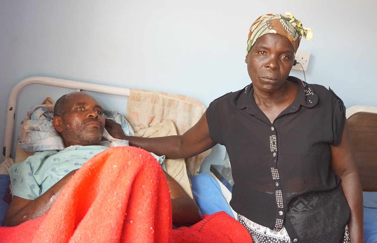 Cyclone Idai survivor Geshem Makufa, 55, is being treated at United Methodist Mutambara Mission Hospital in the Chimanimani District of Eastern Zimbabwe. He is pictured with his wife, Tandiwe Makufa. Photo by Kudzai Chingwe, UMNS. 