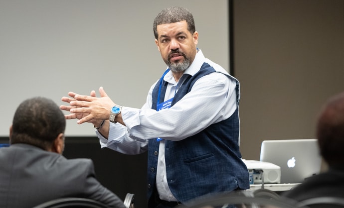 Pastor Benny Custodio of the Never Forsaken Re-Entry Ministry leads a workshop on the impact of mass incarceration. Photo by Mike DuBose, UMNS.