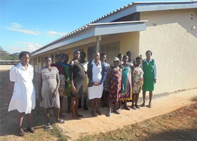Expectant mothers and staff stand outside the new waiting mothers’ shelter in Mutare, Zimbabwe. Photo by Kudzai Chingwe, UMNS.