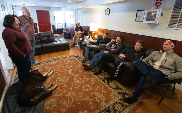 The Rev. Cheryl George (left) visits with Sloan (right) and other recovering addicts at Jacob’s Ladder. “I got involved because I knew we needed this in every county in our state,” George said. Standing with George is Chad Bishop, director of operations for the recovery home. Photo by Mike DuBose, UMNS.