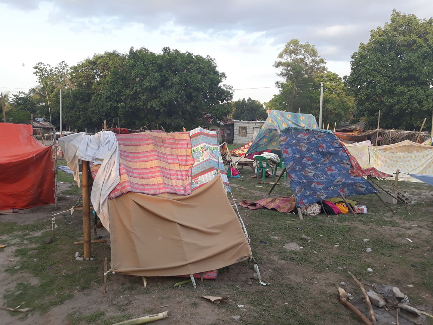 Earthquake evacuees take refuge in tents in Porac, Philippines, in the Pampanga province northwest of Manila. The indigenous Aetas built the tent city after the eruption of Mt. Pinatubo in 1991. Photo by Rommuel S. Flores.