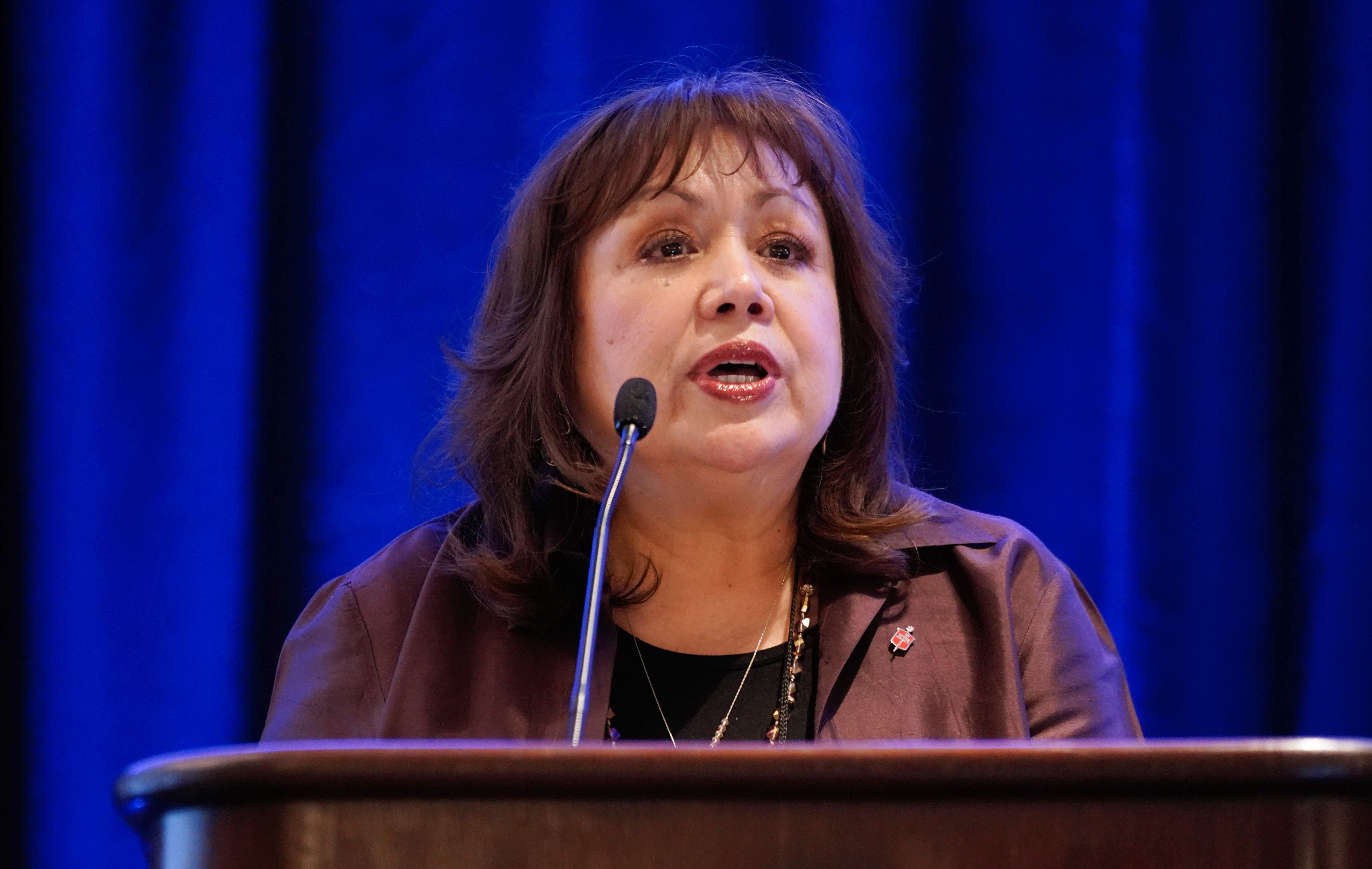 Bishop Minerva Carcaño speaks to her fellow episcopal leaders about the work of the Immigration Task Force during the Council of Bishops meeting near Chicago. Photo by the Rev. Todd Rossnagel, Louisiana Conference.