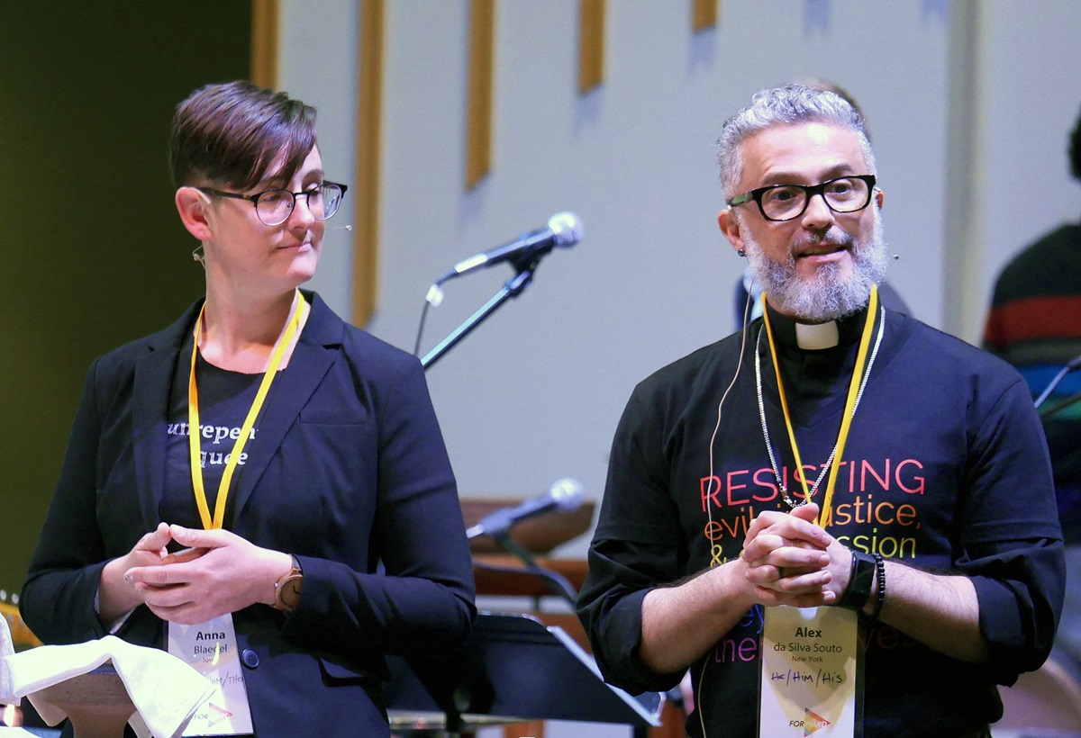 The Revs. Anna Blaedel and Alex da Silva Souto officiate at a communion service concluding the Our Movement Forward conference. The event was geared toward starting a new Methodist movement centered on the voices of people of color and LGBTQ individuals. Photo by Heather Hahn, UM News.