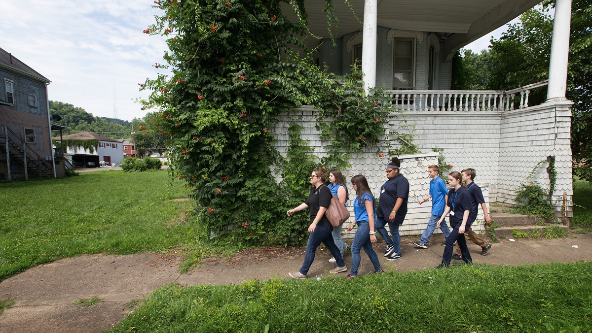 Kate Rhodes (left) leads students from House of the Carpenter back from a field trip on Wheeling Island in Wheeling, W.Va. Rhodes was serving as youth coordinator for the program's Pre-Work Camp, which teaches basic employment skills to middle school students. House of the Carpenter is a mission project of The United Methodist Church's West Virginia Conference. 