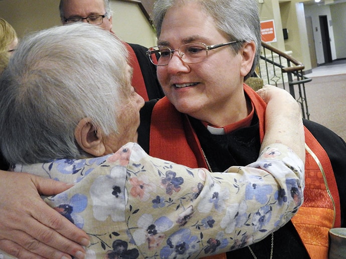The Rev. Jane Graner accepts congratulations after being ordained an elder during a June 3 service at Christ United Methodist Church in Plano, Texas. Graner, 57, is believed to be the first openly gay person ordained an elder in either of the southern jurisdictions of The United Methodist Church. Church law prohibits ordination of “self-avowed practicing” homosexuals, but Graner is single, a fact North Texas Conference officials noted when asked about her ordination. UM News Photo, Sam Hodges.