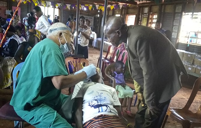 Dr. Julius Stephens, a retired dentist from South Carolina, volunteers with the health mission held in eastern Uganda. Photo by Vivian Agaba, UM News. 