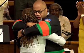 The Rev. Peter Edward Matthews of McKinley United Methodist Church hugs Dai Kirkdemm, founder of Dayton Young Black Professionals. The church partnered with the young professionals in providing space for organizing resources to send them out to help with tornado relief. Photo courtesy of McKinley United Methodist Church. 