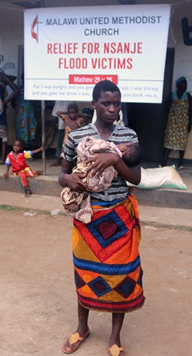 Miriam Black, age 19, holds her newborn baby who was born at the Phokera camp in the Nsanje District in Malawawi. Photo by Francis Nkhoma, UM News.