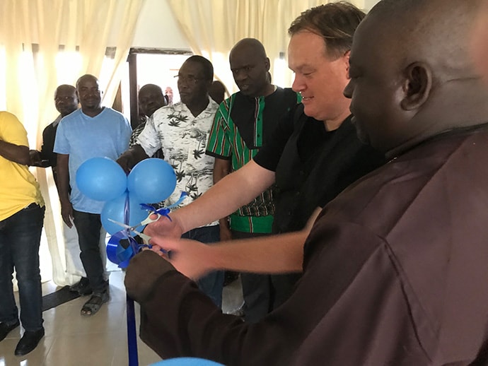 Dan Krause, top staff executive of United Methodist Communications in Nashville, Tenn., and Bishop John Wesley Yohanna, head of the Nigeria Episcopal Area, cut the ribbon during the dedication of the new communications center in Jalingo, Nigeria, on May 30, 2019. Photo by Tim Tanton, UM News.