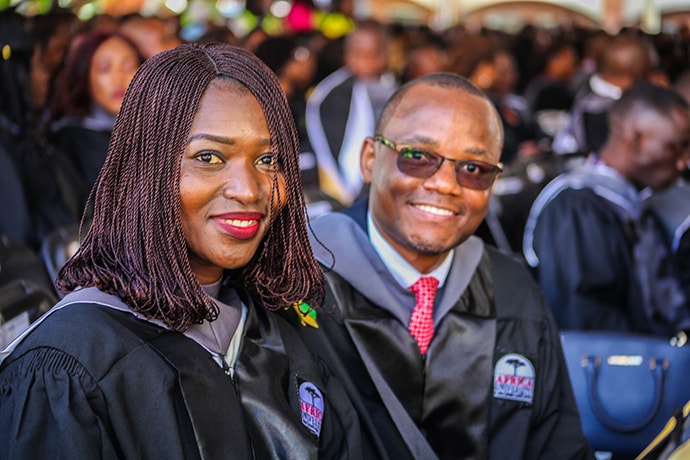 Pambi Jatutu Yusuf (left) and Chris Namilonga are among the 526 young women and men, representing 22 African countries who graduated from Africa University in 2019. Most are first-generation college graduates, and 54.6 percent are women. Photo courtesy of Africa University.