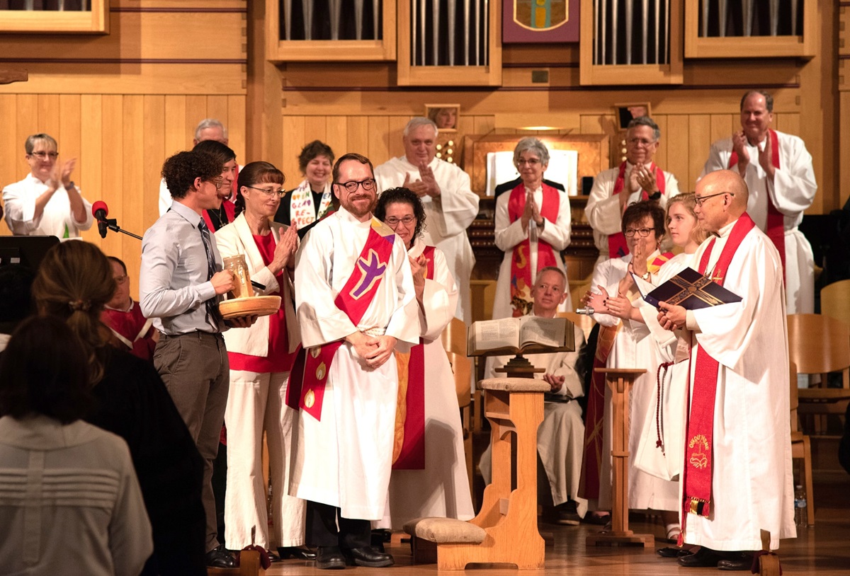 During the 35th session of the Desert Southwest Conference, the Rev. Joshua L. Warner, third from left, was ordained as a deacon. Warner is a gay man. The ordination and commission service included commissioning of Jamie Lynn Booth and Timothy Robert Hunsinger for the work of an elder. Photo courtesy of the Desert Southwest Conference.