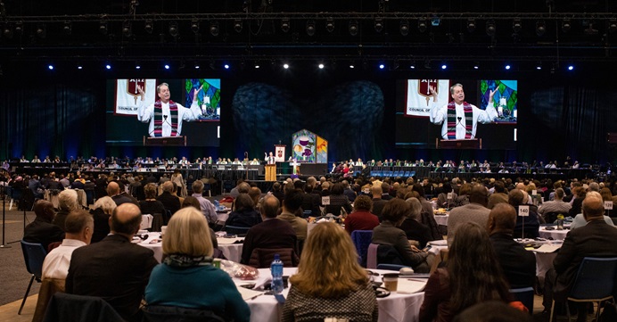 Delegates attend opening worship at the 2019 United Methodist General Conference in St. Louis in February. Given escalating conflict in the denomination over LGBTQ inclusion, two bishops are pushing a plan to create two or three self-governing church groups, with The United Methodist Church remaining as an umbrella organization. File photo by Kathleen Barry, UM News. 