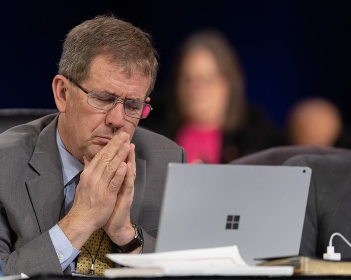 Bishop Scott Jones prays during the 2019 United Methodist General Conference in St. Louis. He and Bishop David Bard have recently offered a plan that would dramatically reorganize The United Methodist Church. File photo by Mike DuBose, UM News.