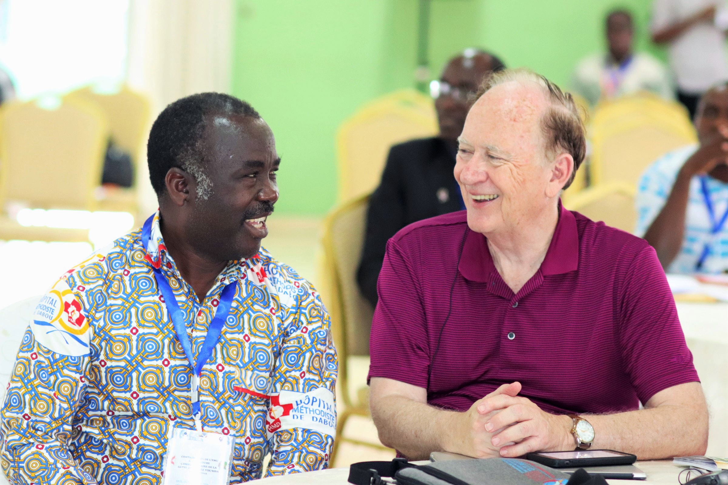 Dr. Daniel Ahui (left), director of the United Methodist Hospital in Dabou, and the Rev. Donald Messer, executive director of the United Methodist-related Center for Health and Hope, at the summit. The Dabou hospital is providing care to 1,362 HIV patients. Photo by Isaac Broune, UMNS.