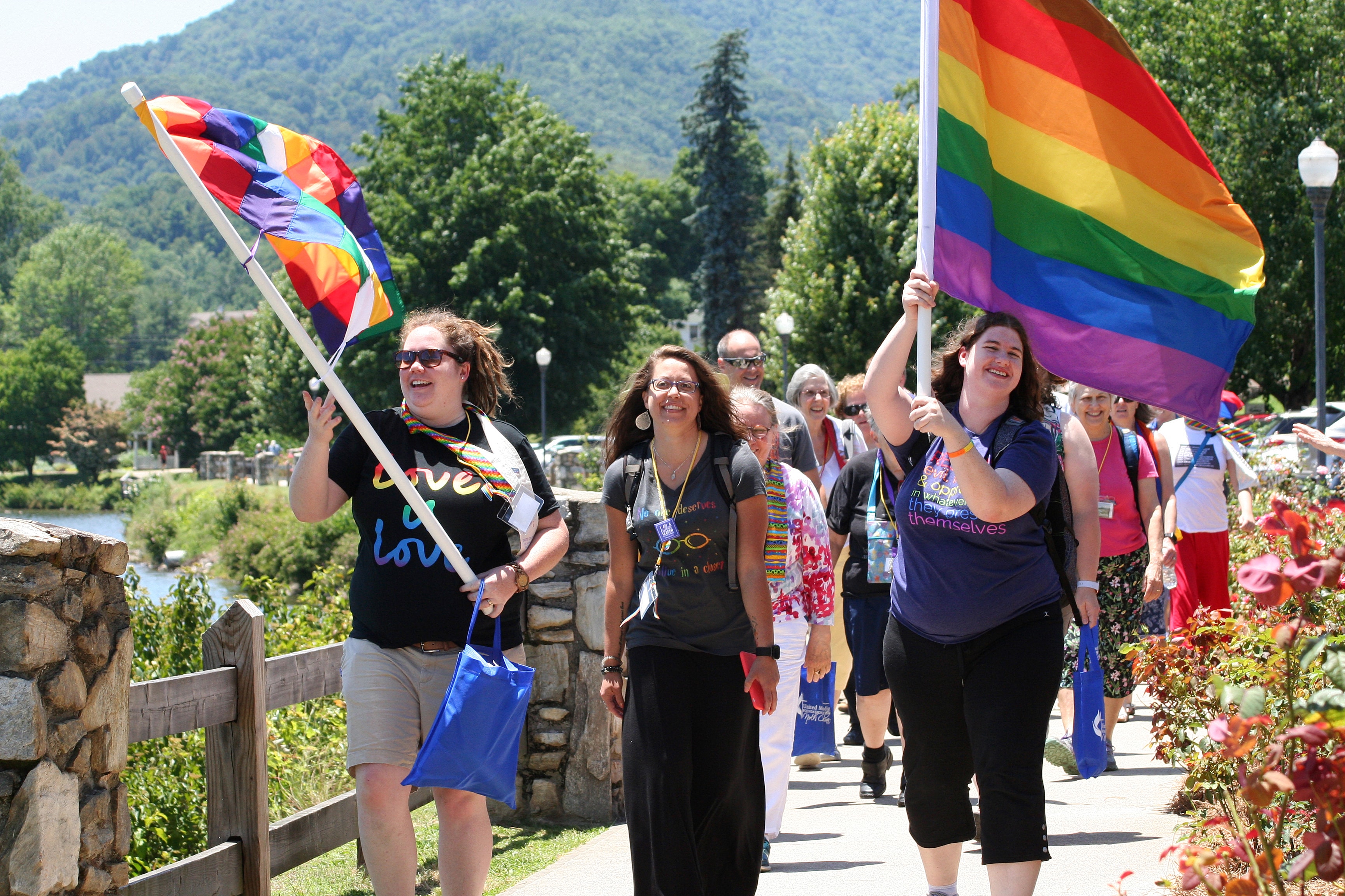 Participants walk in a Reconciling Ministries Pride March during the 2019 Western North Carolina Annual Conference held at Lake Junaluska. Photo by Neill Caldwell, Western North Carolina Conference. 