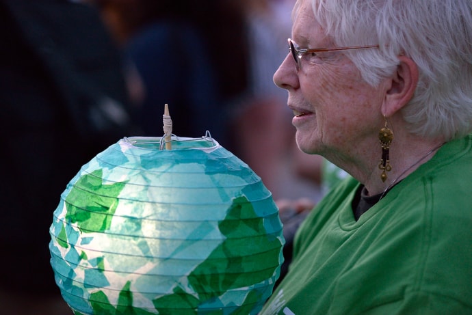 A participant holds a lantern during a climate vigil outside the 2016 United Methodist General Conference in Portland, Ore. The lanterns were lit with a small solar light and following the vigil were sent to community groups in the Philippines, the Democratic Republic of the Congo and the U.S. File photo by Paul Jeffrey, UM News.