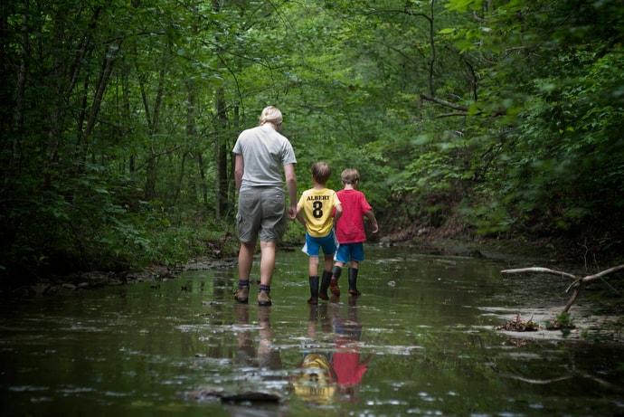 Seasonal naturalist Mary DuBose leads a discovery walk for children along Henry Creek at Beaman Park in Nashville, Tenn., in 2011. In 2017 Wespath added an environmental item to its list of beliefs that help guide where money is invested. File photo by Mike DuBose, UM News.