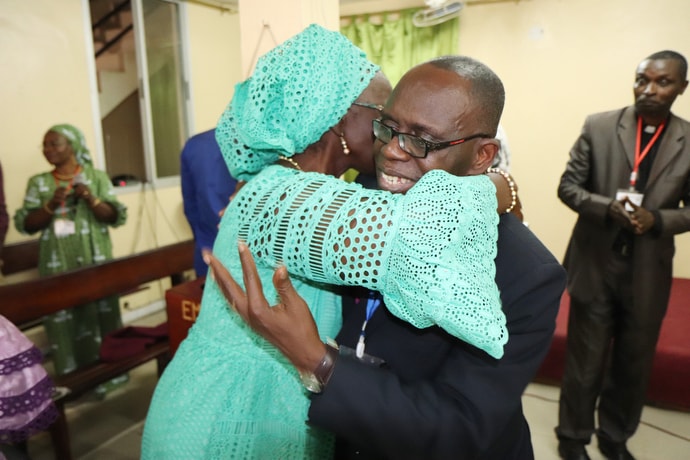 Côte d'Ivoire Area Bishop Benjamin Boni congratulates Ndeye Diouf on her retirement during the closing session of the annual assembly of West African United Methodist mission initiatives in Dakar, Senegal. Photo by Isaac Broune, UM News.
