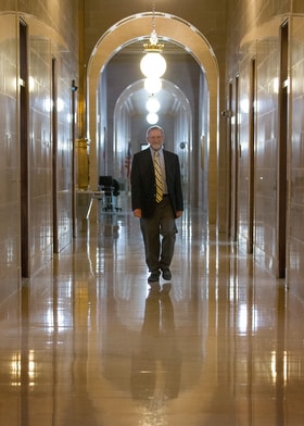 The Rev. Jeff Allen walks through the West Virginia State Capitol in Charleston, where he frequently testifies at hearings in his role as executive director of the West Virginia Council of Churches. One of the big issues Allen and the council have taken up is criminal justice reform relating to opioid addiction. Photo by Mike DuBose, UM News.
