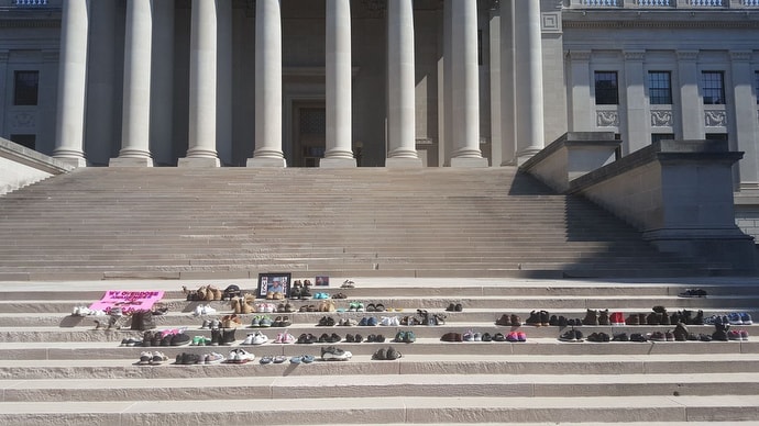 Shoes line the steps of the West Virginia State Capitol in Charleston during the annual Day of Overdose Awareness Tribute in 2016. The event was organized by the parents of Ryan Brown, who died from an overdose. Photo by Rick Bowles, Ryan’s Hope.
